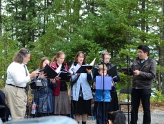 Mark Donnelly with his family singing at the CRCC  Mass 2018