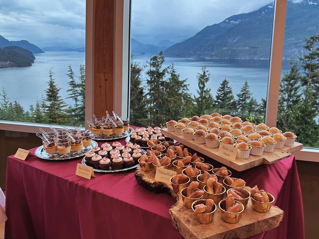 Copper Ridge dining room set for dinner, looking out over Howe Sound